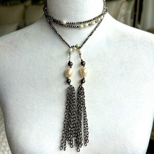 Beaded lariat necklace with faceted gray beads ending with chain hassles